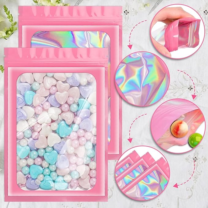 ANZNKU 100 Pack Mylar Bags Reasealable Holographic Bags, Smell Proof Bag Zipper Pouches with Clear Window, Jewelry Candy Sealable Bag for Packaging Sample Party Favor (Pink, 7.1 x 10.2 Inch)