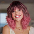 Nnzes Pink Wig with Bangs for Women Short Bob Wavy Charming Synthetic Wigs with Natural Shoulder Length Curly Heat Resistant Fiber Hair for Daily Party Use