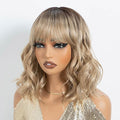 NOBLE Bob Wig with Bangs Short Wavy Wig for Women Ombre Mix Blonde Shoulder Length Wig Heat Resistant Synthetic Wigs for Daily Party Use 12 Inches