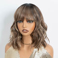 NOBLE Bob Wig with Bangs Short Wavy Wig for Women Ombre Mix Blonde Shoulder Length Wig Heat Resistant Synthetic Wigs for Daily Party Use 12 Inches